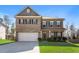 Charming two-story home featuring a brick and siding facade and manicured lawn at 238 Gallant Fox Way, Acworth, GA 30102