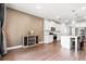 Modern kitchen with stainless steel appliances, white cabinets, and a center island with bar stools at 238 Gallant Fox Way, Acworth, GA 30102