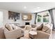 Comfortable living room featuring neutral decor, fireplace, and ample natural light at 238 Gallant Fox Way, Acworth, GA 30102