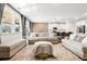 Spacious living room featuring neutral decor, an area rug, and seamless flow to the kitchen at 238 Gallant Fox Way, Acworth, GA 30102