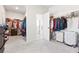 Spacious walk-in closet with ample storage and organization options for clothing and accessories at 238 Gallant Fox Way, Acworth, GA 30102