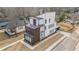 Aerial view of a modern home featuring a balcony and spacious driveway at 662 S Grand Nw Ave, Atlanta, GA 30318