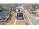 Aerial view of modern three-story home with balconies and landscaped yard at 662 S Grand Nw Ave, Atlanta, GA 30318