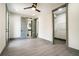 Spacious bedroom with wood flooring, ceiling fan, and ensuite bathroom and closet at 662 S Grand Nw Ave, Atlanta, GA 30318