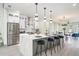 Modern kitchen featuring an island with marble countertop and stainless steel appliances at 662 S Grand Nw Ave, Atlanta, GA 30318