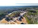 An aerial view showing the surrounding wooded community in a suburban neighborhood at 71 Presley Farm Ln, Rockmart, GA 30153