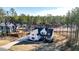 Aerial view of a modern farmhouse showcasing its roofline, landscaping, and large lot at 71 Presley Farm Ln, Rockmart, GA 30153