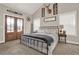 Bedroom with cathedral ceiling and large windows offers natural light and rustic decor at 71 Presley Farm Ln, Rockmart, GA 30153