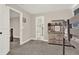 Well-lit bedroom featuring neutral walls, carpeted floors, and access to a private ensuite bathroom at 71 Presley Farm Ln, Rockmart, GA 30153