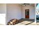 Wooden door leads outside with stacked firewood against the white plank wall at 71 Presley Farm Ln, Rockmart, GA 30153