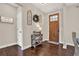 Foyer with dark hardwood floors and decorations that give a comfortable, welcoming feeling at 71 Presley Farm Ln, Rockmart, GA 30153