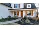 Welcoming front porch with natural wood accents, a stylish welcome sign, and a cozy seating area at 71 Presley Farm Ln, Rockmart, GA 30153