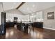 Modern kitchen with black and white cabinets, a large center island, and hardwood floors at 71 Presley Farm Ln, Rockmart, GA 30153