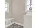 Laundry room with tile floor, a window, and seating area at 71 Presley Farm Ln, Rockmart, GA 30153