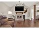 Hardwood floors, fireplace, antler display, and vaulted ceilings create a cozy living room at 71 Presley Farm Ln, Rockmart, GA 30153