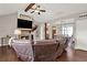 Living room with hardwood floors, stone fireplace, vaulted ceilings, and an antler display at 71 Presley Farm Ln, Rockmart, GA 30153