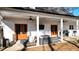 A view of the covered back patio that features patio furniture and a gas barbeque at 71 Presley Farm Ln, Rockmart, GA 30153