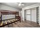 Cozy bedroom featuring a wooden bunk bed and a closet with shelving, perfect for a ' room at 1031 Steeple Run, Lawrenceville, GA 30043