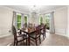 Elegant dining room with natural light, classic table set, and stylish light fixture at 1031 Steeple Run, Lawrenceville, GA 30043