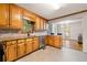 Kitchen with wood cabinetry and stone countertops at 1031 Steeple Run, Lawrenceville, GA 30043