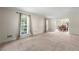 Bright living room featuring plush carpeting, large windows and neutral color pallette at 1031 Steeple Run, Lawrenceville, GA 30043