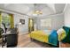 Inviting main bedroom with a tray ceiling, ceiling fan, and large windows, providing ample natural light at 1031 Steeple Run, Lawrenceville, GA 30043