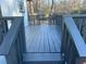 This back deck has black wooden railings and steps at 1055 Pinecrest Dr, Forest Park, GA 30297