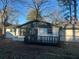 This backyard features a wooden deck with black trim on a sunny day at 1055 Pinecrest Dr, Forest Park, GA 30297