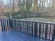 This backyard has a wooden deck and a view of a wooded area at 1055 Pinecrest Dr, Forest Park, GA 30297