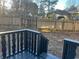 This backyard has a deck with black railings and a view of a wooden fence at 1055 Pinecrest Dr, Forest Park, GA 30297