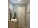 Charming bathroom features a well-lit vanity, a stylish mirror, and neutral walls, exuding comfort at 1055 Pinecrest Dr, Forest Park, GA 30297