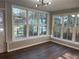 This eating area has hardwood floors, white trim, many windows and a view outside at 1055 Pinecrest Dr, Forest Park, GA 30297