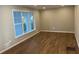 The living room features hardwood floors and a window, creating a welcoming space at 1055 Pinecrest Dr, Forest Park, GA 30297