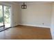 Bright dining room with hardwood floors and sliding glass doors to the outside at 6441 Holiday Blvd, Forest Park, GA 30297