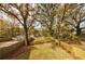 Expansive backyard with lush green grass and a privacy fence, perfect for outdoor activities at 676 S Grand Nw Ave, Atlanta, GA 30318