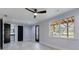 Bright bedroom featuring a ceiling fan, hardwood floors, and lots of natural light at 676 S Grand Nw Ave, Atlanta, GA 30318