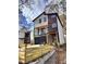 Modern two-story home with mixed siding, large windows, and a well-maintained lawn with custom wood fence at 676 S Grand Nw Ave, Atlanta, GA 30318