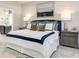 Beautiful bedroom with a king-size bed, grey walls, and ensuite bathroom at 1141 Burlington Ct, Mcdonough, GA 30253