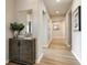 Inviting hallway featuring modern decor, wood-look flooring, and ample natural light at 1141 Burlington Ct, Mcdonough, GA 30253