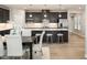Open-concept kitchen and dining area with stainless steel appliances and large central island at 1141 Burlington Ct, Mcdonough, GA 30253