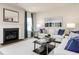 Cozy living room featuring a fireplace, comfortable seating, and stylish decor at 1141 Burlington Ct, Mcdonough, GA 30253