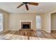 Bright living room featuring a brick fireplace, hardwood floors, and natural light at 711 Providence Dr, Lawrenceville, GA 30044