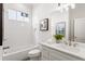 Modern bathroom featuring a tub, subway tile, and a single sink vanity with ample counter space at 965 Boulevard Se # A, Atlanta, GA 30312