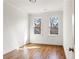 Bedroom featuring hardwood floors and two windows, offering a simple yet elegant space at 965 Boulevard Se # A, Atlanta, GA 30312