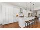 Modern kitchen features stainless steel appliances, a center island with seating, and ample white cabinetry at 965 Boulevard Se # A, Atlanta, GA 30312