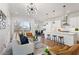 Bright and airy open-concept living area features hardwood floors, modern lighting, and seamless kitchen access at 965 Boulevard Se # A, Atlanta, GA 30312