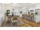 Stylish dining area with an adjacent breakfast bar and modern light fixture at 20 S Eugenia Nw Pl, Atlanta, GA 30318