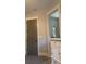 Hallway view leading to ensuite bathroom, complete with neutral carpet and modern trim at 4666 Magnolia Commons, Dunwoody, GA 30338