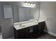 Bathroom features dual sinks and a large mirror at 7214 Bedrock Cir, Lithonia, GA 30038