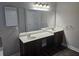 Bathroom features a double vanity, large mirror, and wood-look flooring at 7214 Bedrock Cir, Lithonia, GA 30038